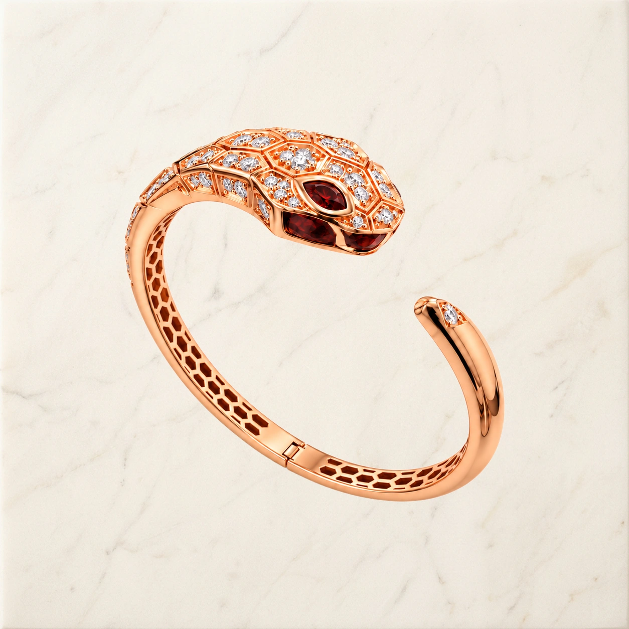 Rose-gold hinged snake jewelry with red gemstones and diamonds on warm ivory marble